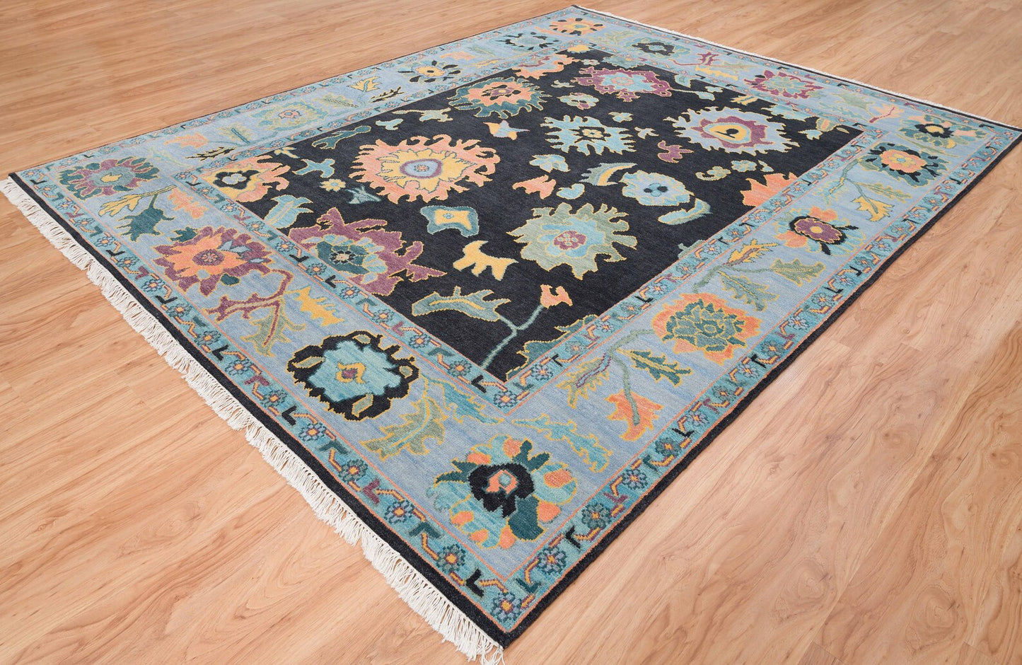 Modern Sky Blue Oushak Rug – Colorful Turkish Wool Area Carpet | Black Base with Orange, Purple & Green Floral Accents