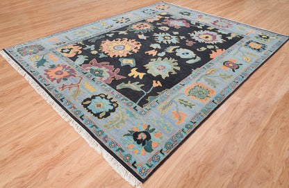 Modern Sky Blue Oushak Rug – Colorful Turkish Wool Area Carpet | Black Base with Orange, Purple & Green Floral Accents